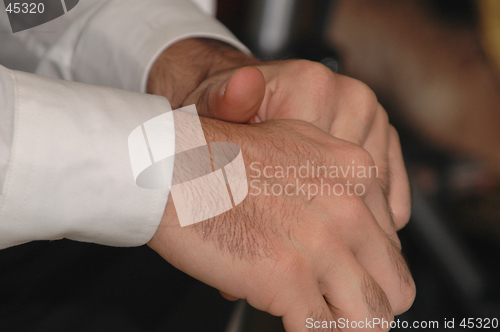 Image of clasped hands