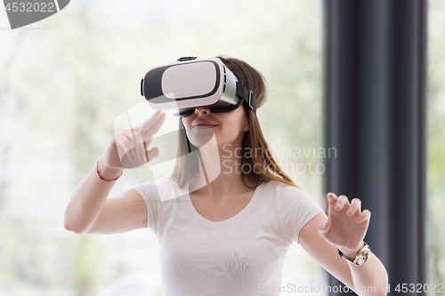 Image of woman using VR-headset glasses of virtual reality