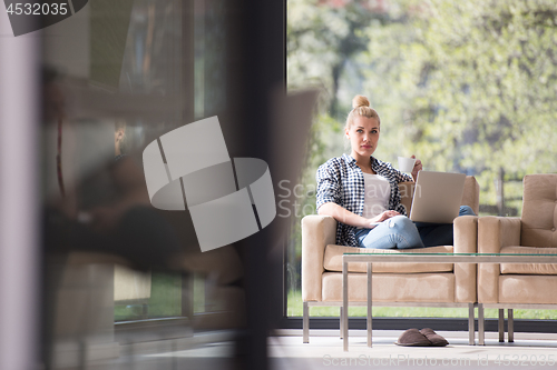 Image of woman drinking coffee enjoying relaxing lifestyle