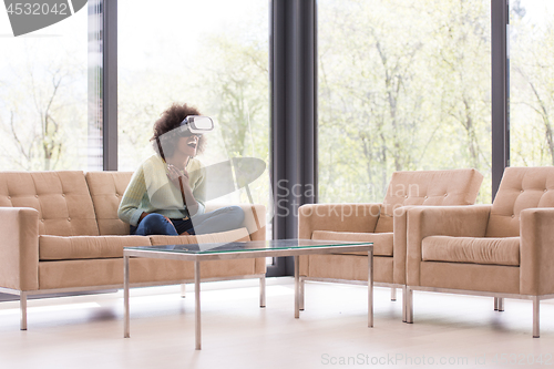 Image of black woman using VR headset glasses of virtual reality