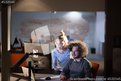 Image of young designers in the night office