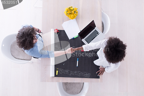Image of top view of Multiethnic startup business team on meeting