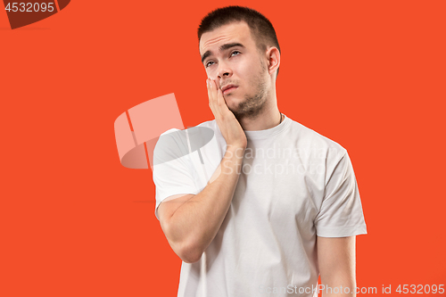 Image of Young man is having toothache.