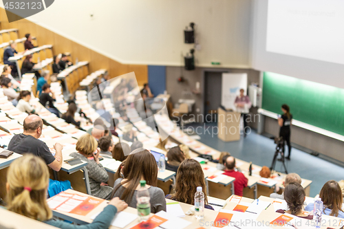 Image of Expert speaker giving a talk at scientific business conference event.