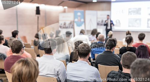 Image of Business speaker giving a talk at business conference event.