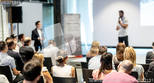 Image of Male business speaker giving a talk at business conference event.