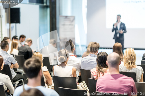 Image of Male business speaker giving a talk at business conference event.