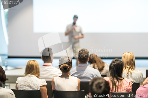 Image of Male business speaker giving a talk at business conference event.