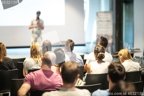 Image of Male business speaker giving a talk at business conference event.