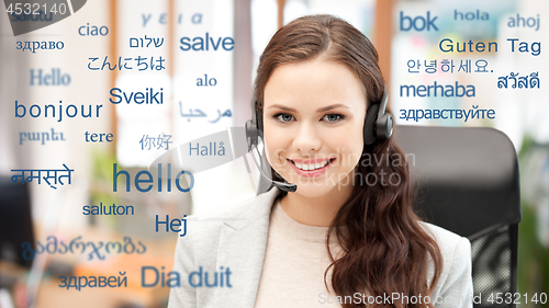 Image of woman in headset over words in foreign languages