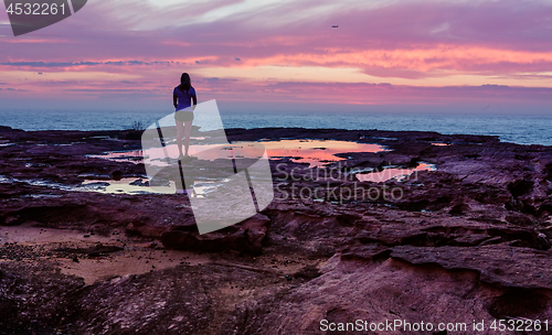 Image of Standing in the stillness of the sunrise morning