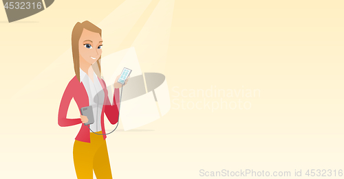 Image of Woman reharging smartphone from portable battery.