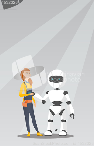 Image of Young caucasian woman handshaking with robot.