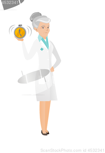 Image of Senior caucasian doctor holding alarm clock.