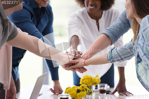 Image of multiethnic startup Group of young business people celebrating s