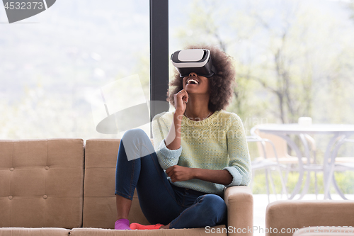 Image of black woman using VR headset glasses of virtual reality