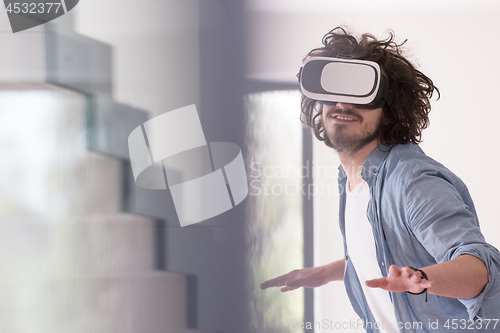 Image of man using VR-headset glasses of virtual reality