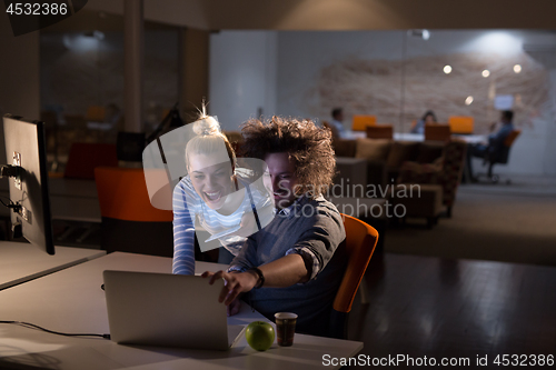 Image of young designers in the night office