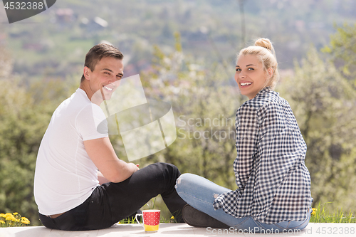 Image of couple enjoying morning coffee