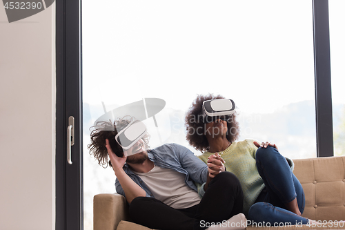 Image of Multiethnic Couple using virtual reality headset