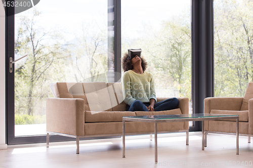 Image of black woman using VR headset glasses of virtual reality