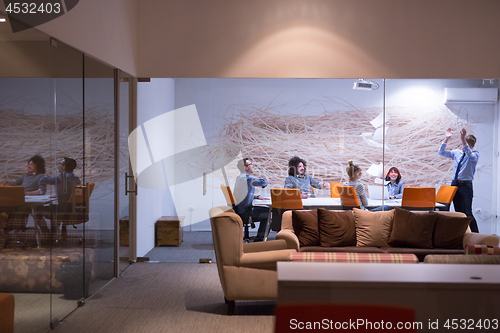 Image of Group of young business people throwing documents