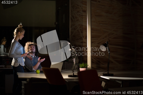 Image of young designers in the night office