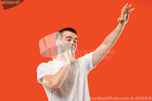 Image of Isolated on pink young casual man shouting at studio