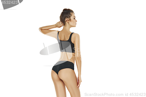 Image of Fit, healthy and sporty girl in swimsuit. Sport, fitness, diet and healthcare concept.