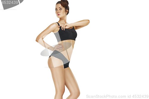 Image of Fit, healthy and sporty girl in swimsuit. Sport, fitness, diet and healthcare concept.