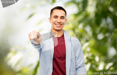 Image of man pointing finger to you over white background