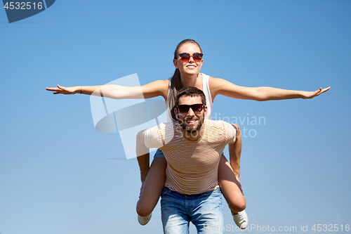 Image of happy couple having fun in summer