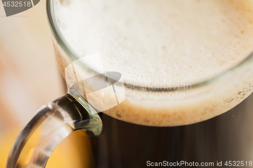 Image of close up of dark draft beer glass mug