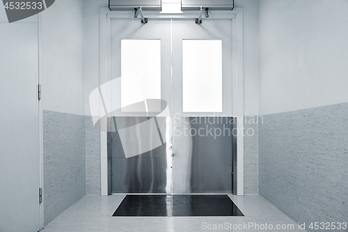 Image of steel doors in hospital corridor