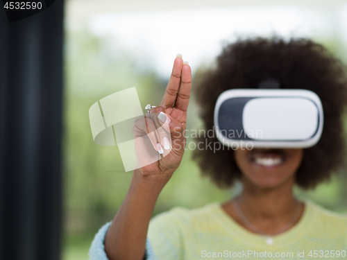 Image of black woman using VR headset glasses of virtual reality