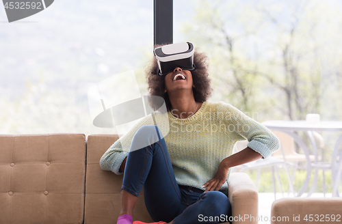 Image of black woman using VR headset glasses of virtual reality