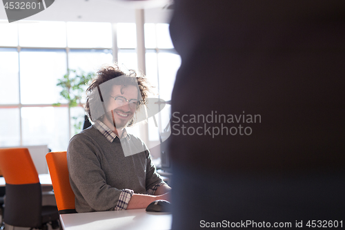 Image of businessman working using a computer in startup office