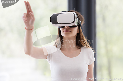 Image of woman using VR-headset glasses of virtual reality