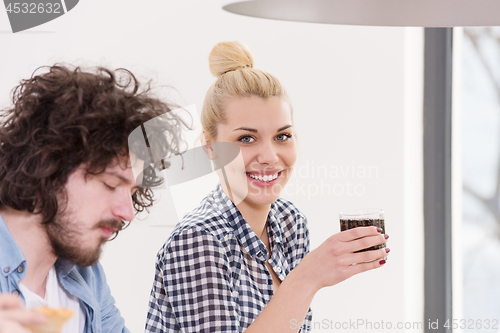 Image of multiethnic group of happy friends lunch time