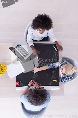 Image of top view of Multiethnic startup business team on meeting