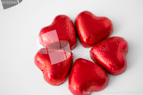 Image of close up of red heart shaped chocolate candies