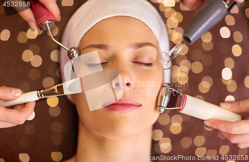 Image of woman having hydradermie facial treatment in spa