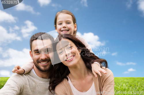 Image of happy family over blue sky and grass background