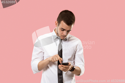 Image of Handsome businessman with mobile phone