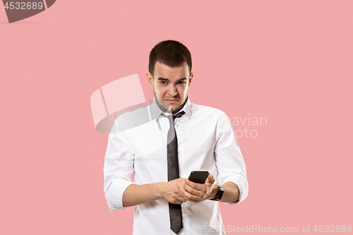 Image of Handsome businessman with mobile phone