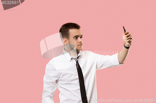 Image of Handsome businessman with mobile phone