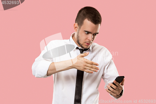 Image of Handsome businessman with mobile phone