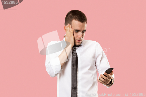 Image of Handsome businessman with mobile phone