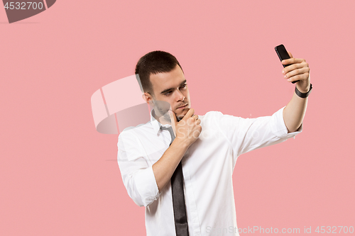 Image of Handsome businessman with mobile phone