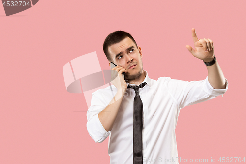 Image of Handsome businessman with mobile phone